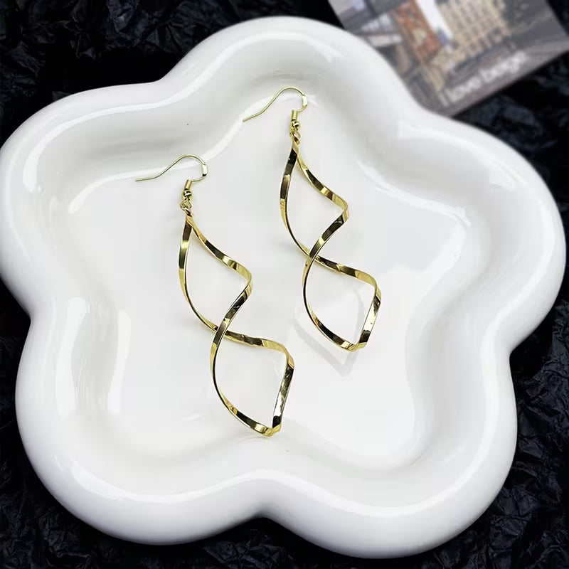 Spiral Dangle Orecchini | Oro