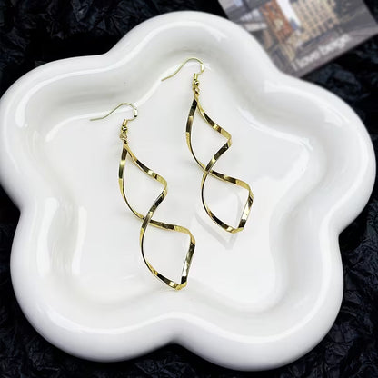 Spiral Dangle Orecchini | Oro