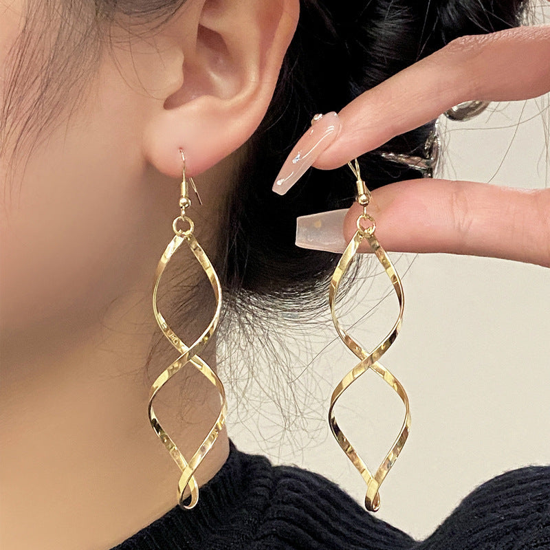 Spiral Dangle Orecchini | Oro